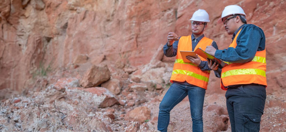 Geologist surveying mine,Explorers collect soil samples to look for minerals.