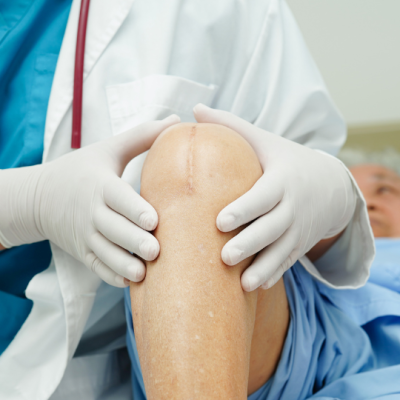 Clinical translation of laser bone sculpting for total knee replacements
